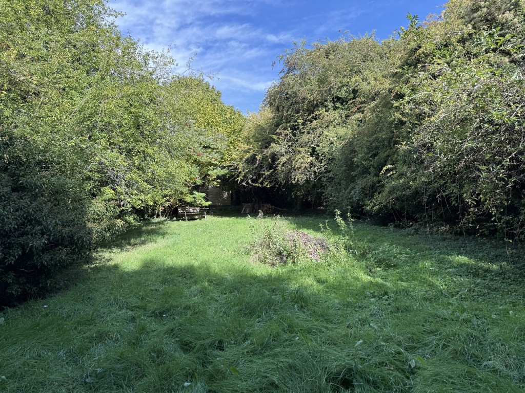 Lot: 47 - APPROXIMATELY HALF AN ACRE OF LAND WITH VACANT POSSESSION - View looking towards garage